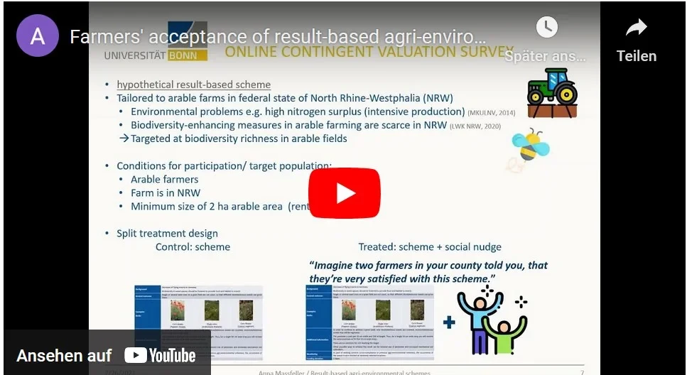 Eine Wissenschaftlerin und ein Wissenschaftler arbeiten hinter einer Glasfassade und mischen Chemikalien mit Großgeräten.